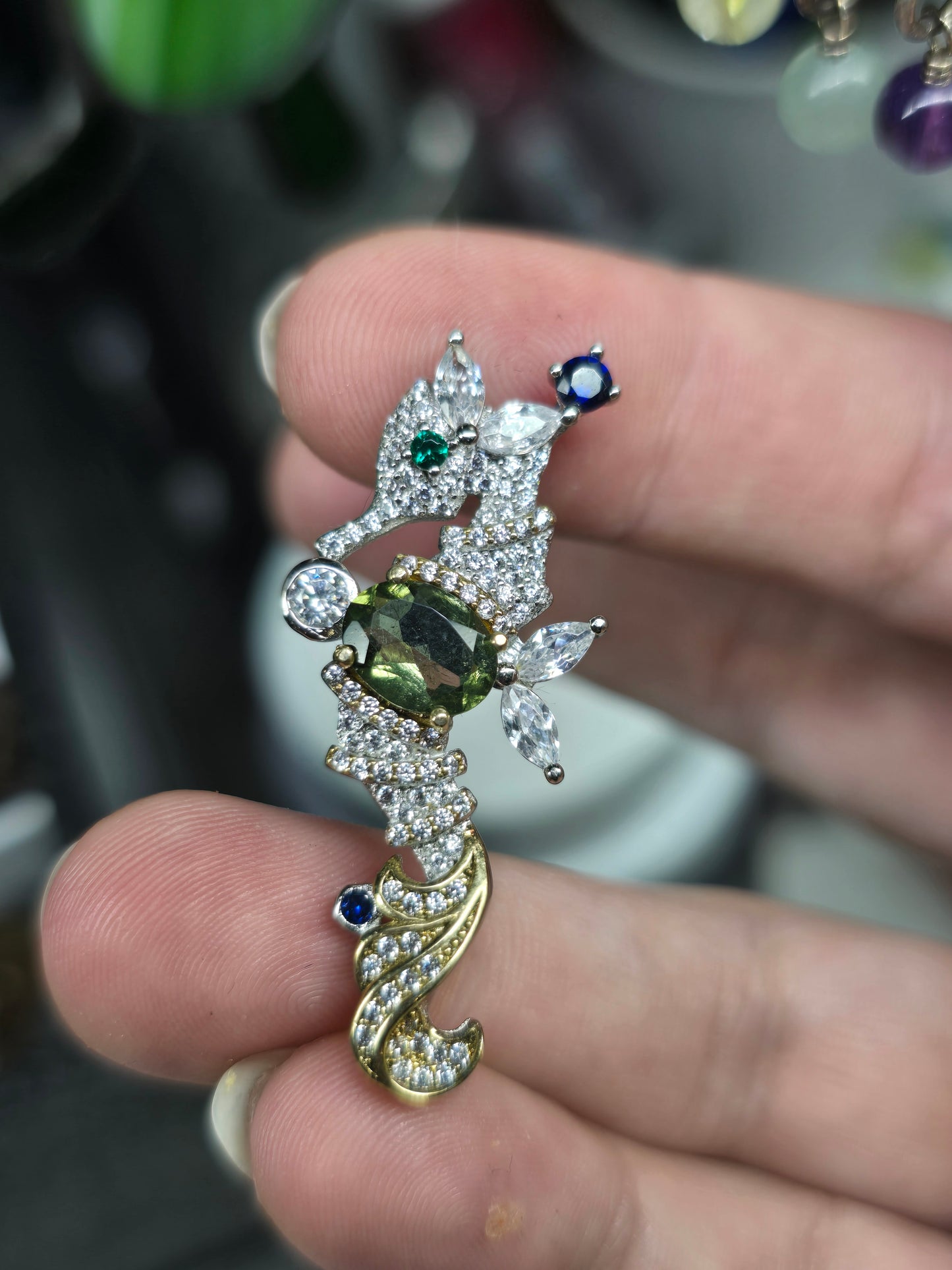 Moldavite seahorse pendant.