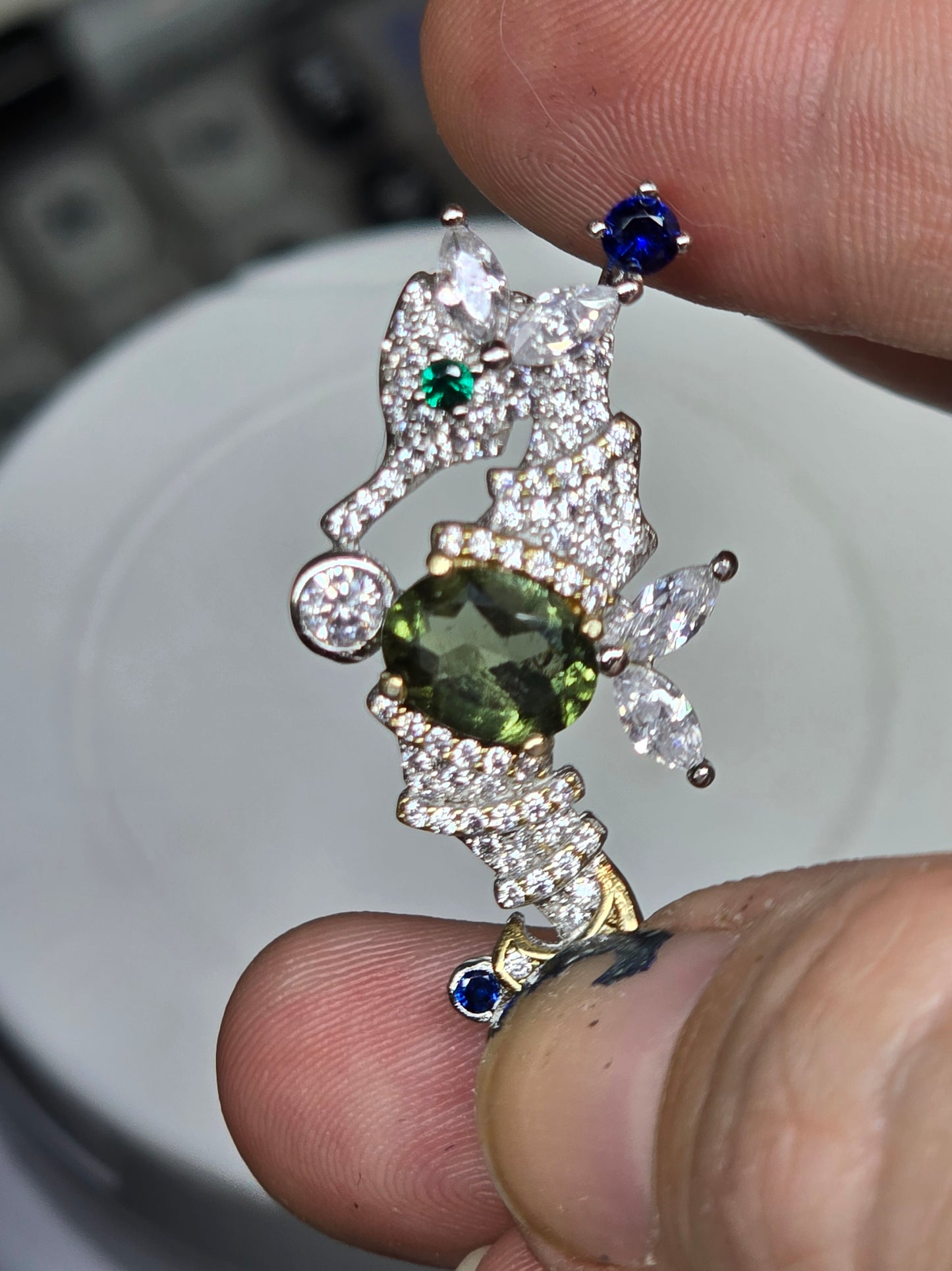 Moldavite seahorse pendant.